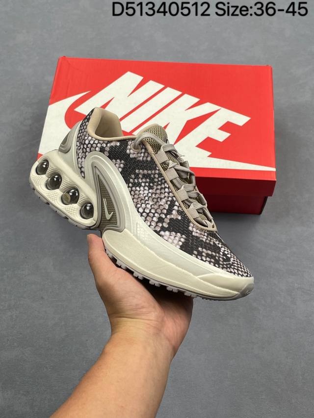 全新Nike Air Max Dn 运动鞋 时尚跑步鞋，豆荚造型气垫吸睛！鞋面采用织物材质打造，提供舒适的穿着体验。这款鞋不仅具有时尚的外观，还融合了许多经典的