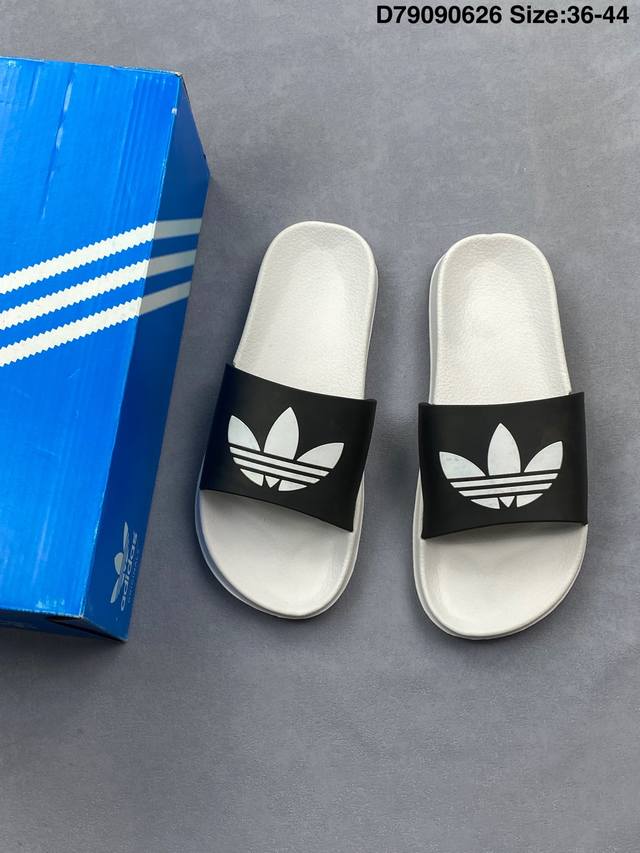 Adidas Originals Adilette 阿迪达斯 运动舒适 橡胶底一字拖鞋 Adilette以日常休闲风格成为赛后休息 沙滩漫步的良伴 这款拖鞋 含