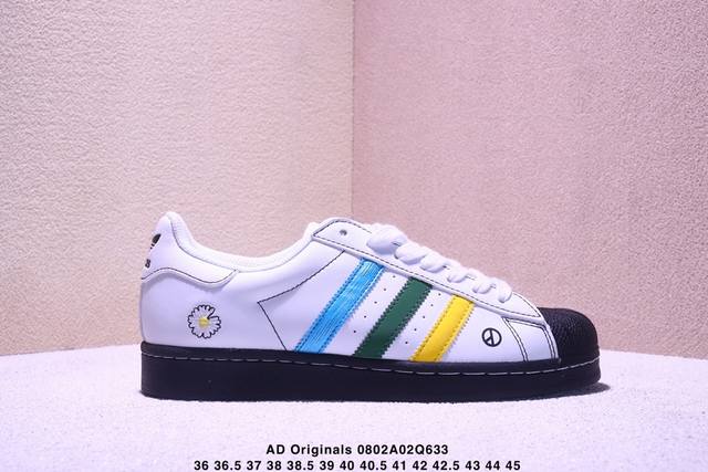 纯原 Clot X Ad Originals #贝壳头权志龙联名限定 贴合柔软皮料蓝绿黄三道杠配色 ，这双鞋的整体设计思路和风格可以说很Clot。鞋款整体选用了
