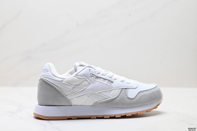 公司级Reebok Classic Leather 舒适日常耐磨透气 低帮跑步鞋 鞋身采用高档麂皮制作，鞋面整体黑白拼接，中间以一条车线贯穿。而侧面的 Reeb