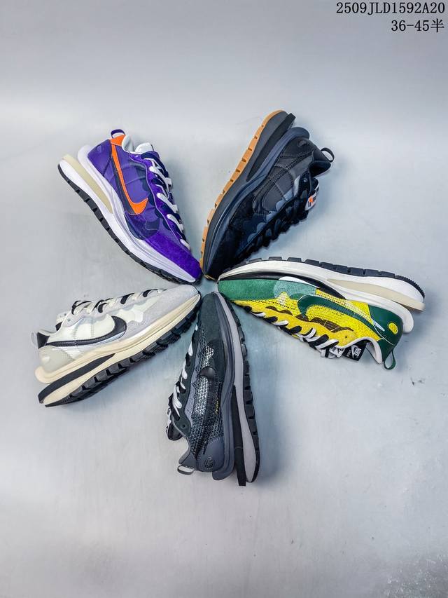 耐克Sacai X Nike Regasus Vaporrly Sp 华夫双勾三代3.0走秀 鞋身材质由翻毛皮和透气网布共同打造。熟悉的解构手法、重叠Swoos