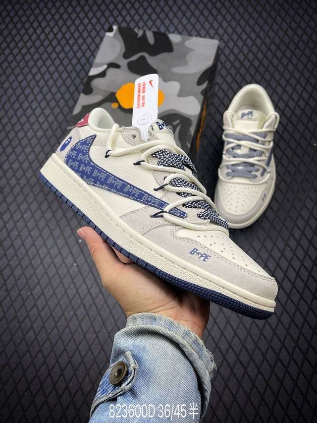 公司级bape X Air Jordan 1 Low 蓝勾抽绳 此款主张打破传统的工业化流水线设计限制，以made By Ideas的超级创意为理念，集结众多潮